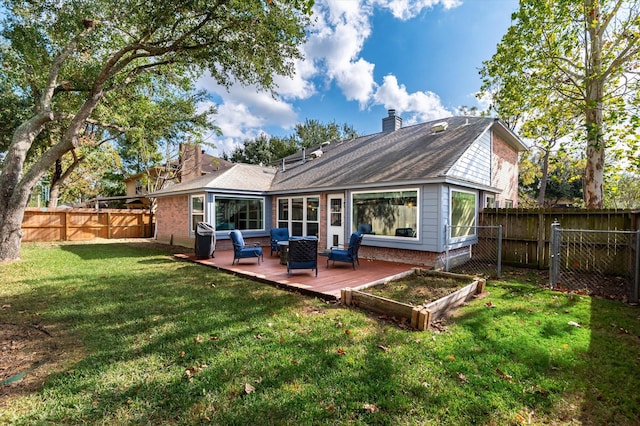 back of house with a lawn, an outdoor living space, and a deck