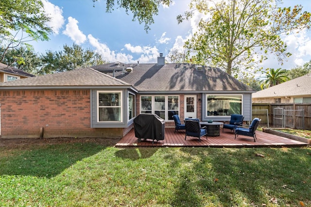 back of property with a wooden deck, an outdoor living space, and a yard