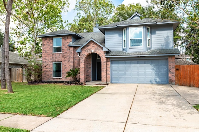 front facade featuring a front yard and a garage