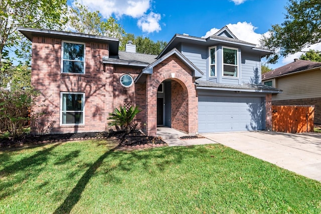 view of front facade featuring a garage and a front yard