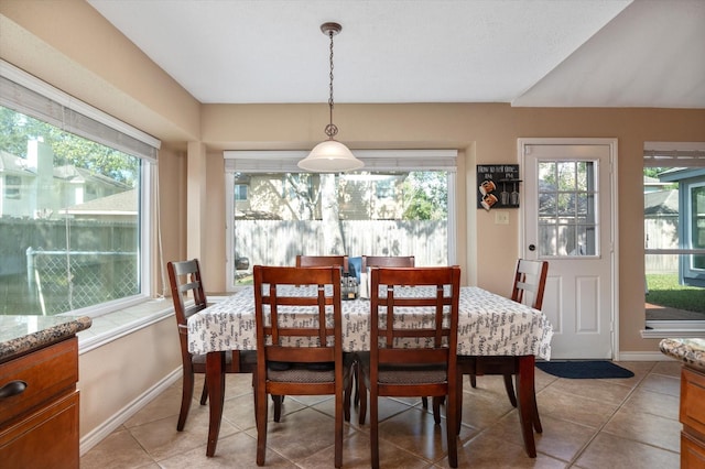 dining room featuring plenty of natural light and light tile patterned floors