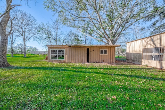 view of outdoor structure with a lawn