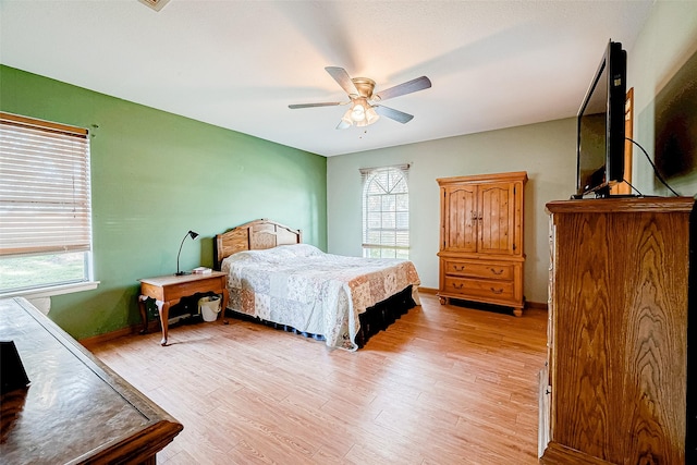 bedroom featuring light wood-type flooring and ceiling fan