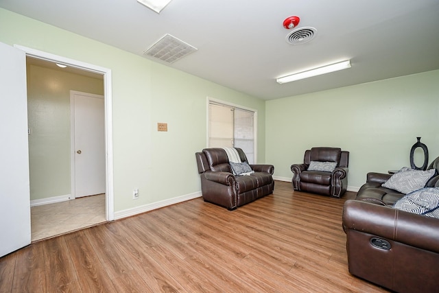 living room with light hardwood / wood-style flooring