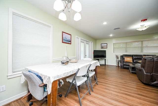 dining space featuring french doors and light hardwood / wood-style flooring