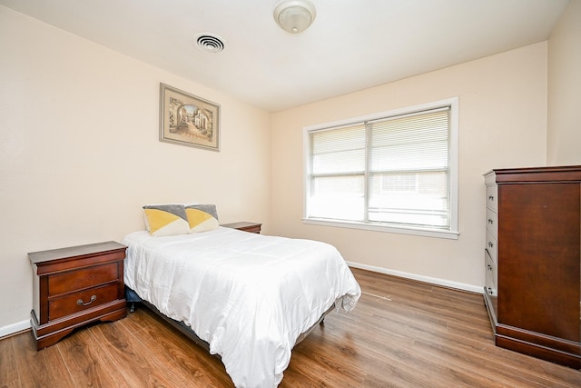 bedroom featuring wood-type flooring