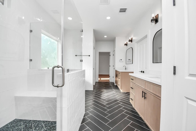 bathroom with vanity and an enclosed shower