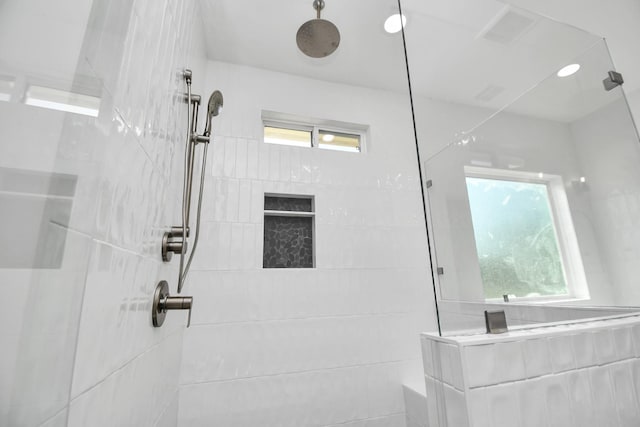 bathroom featuring a tile shower