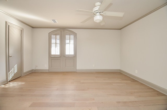 empty room with french doors, light hardwood / wood-style flooring, ceiling fan, and ornamental molding