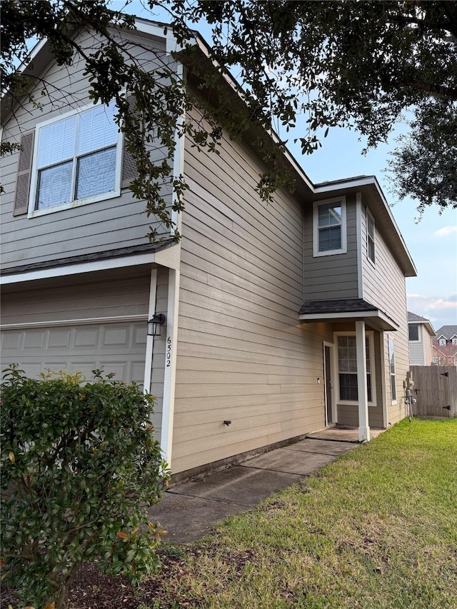 exterior space featuring a front yard and a garage