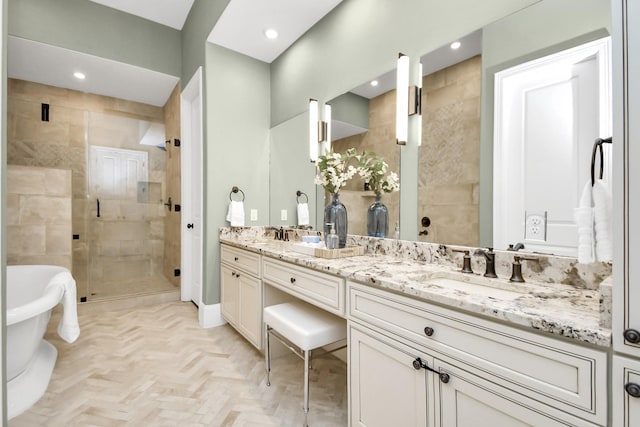 bathroom featuring parquet floors, vanity, and shower with separate bathtub