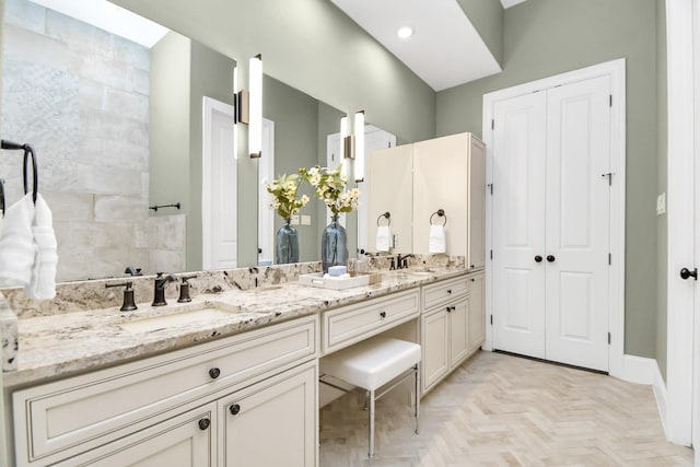 bathroom featuring vanity and parquet floors