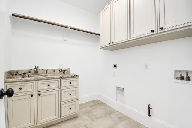 washroom with sink, cabinets, electric dryer hookup, gas dryer hookup, and hookup for a washing machine