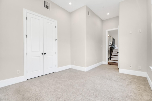 interior space featuring light colored carpet