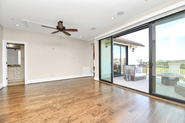 empty room with ceiling fan and hardwood / wood-style floors