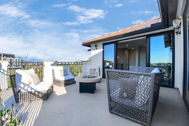 view of patio featuring an outdoor hangout area and a balcony