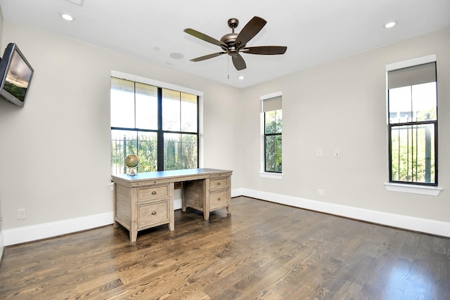 office area with ceiling fan, a healthy amount of sunlight, and dark hardwood / wood-style flooring