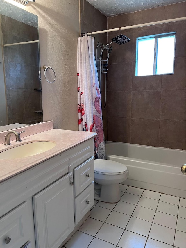 full bathroom featuring tile patterned floors, vanity, toilet, and shower / bath combination with curtain