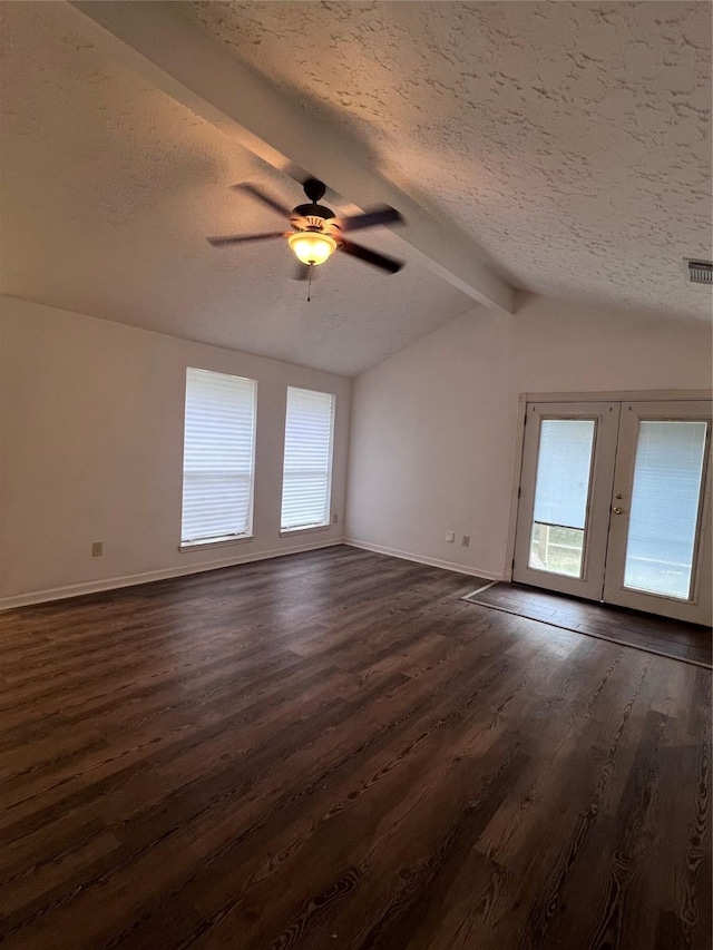 unfurnished room with french doors, a textured ceiling, ceiling fan, dark wood-type flooring, and lofted ceiling with beams