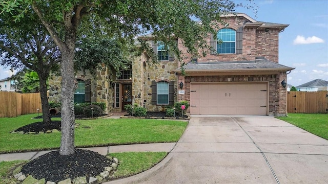 view of front of house featuring a garage and a front yard