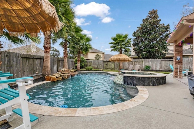 view of pool featuring an in ground hot tub