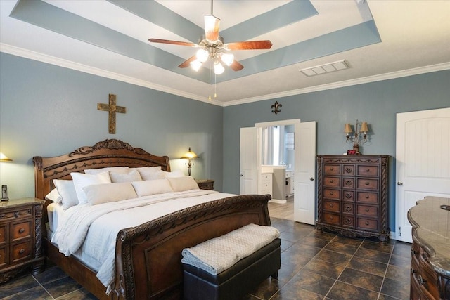 bedroom with a tray ceiling, ceiling fan, and crown molding