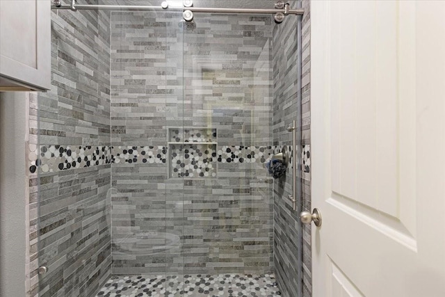 bathroom with tiled shower