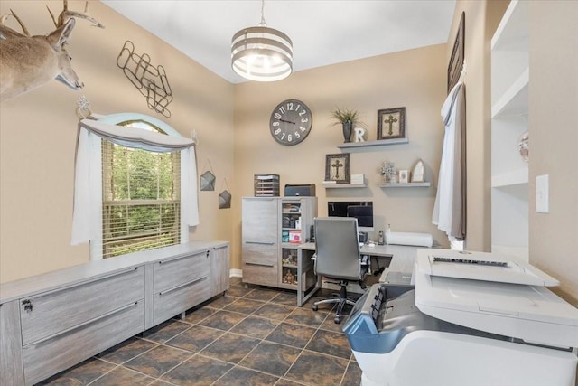 home office with a notable chandelier