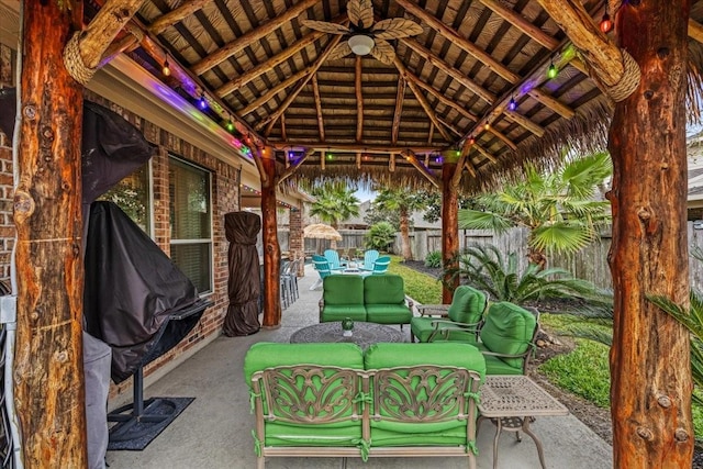 view of patio / terrace featuring outdoor lounge area, a gazebo, and ceiling fan