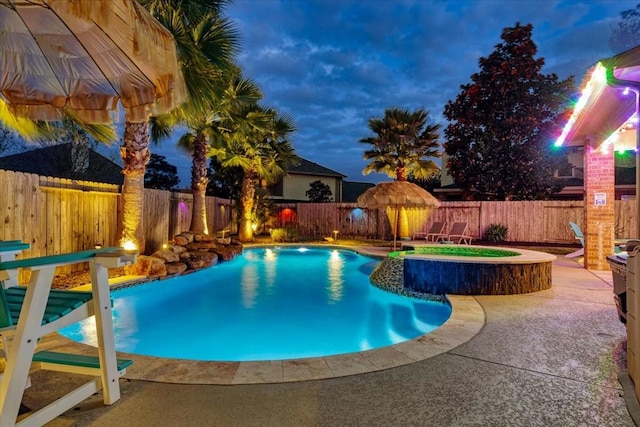 view of pool featuring an in ground hot tub and a patio area