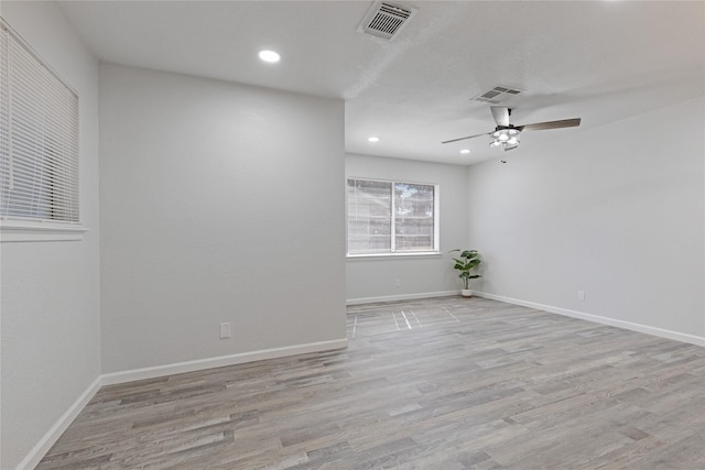 unfurnished room with ceiling fan and light hardwood / wood-style floors