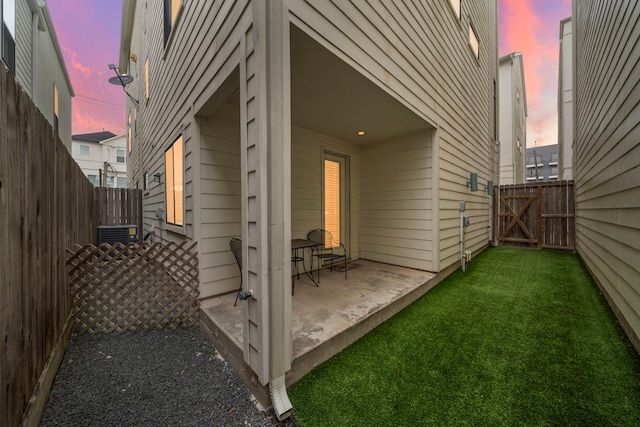 exterior space with a patio area and a yard