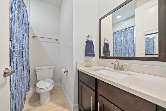 bathroom featuring vanity, toilet, and walk in shower