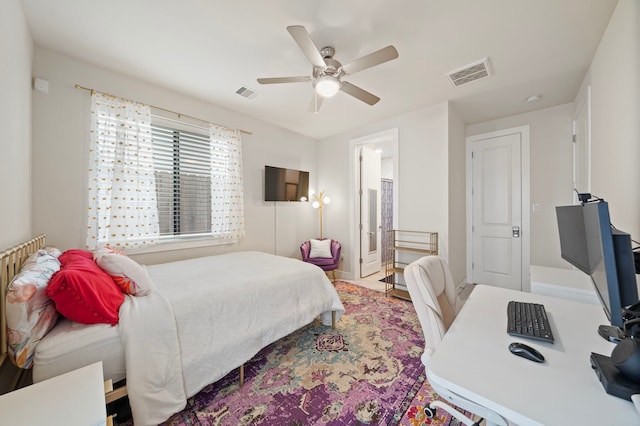 bedroom featuring connected bathroom and ceiling fan