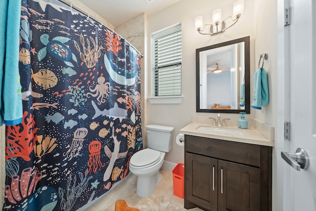 bathroom featuring vanity, a shower with shower curtain, and toilet