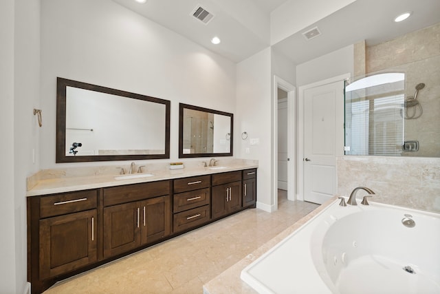 bathroom with tile patterned floors, vanity, and separate shower and tub