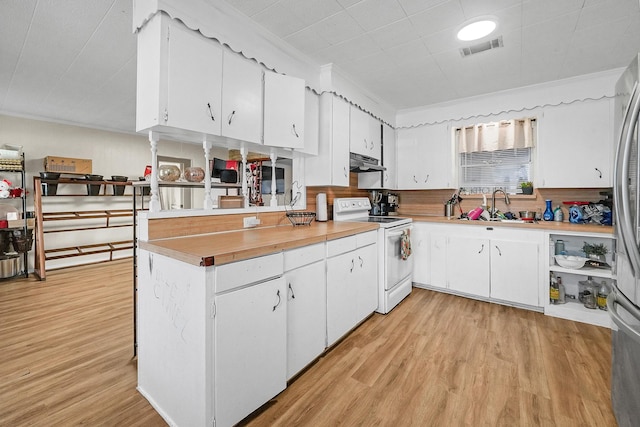 kitchen featuring white cabinets, crown molding, electric stove, and sink