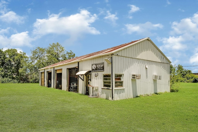 view of outbuilding with a yard