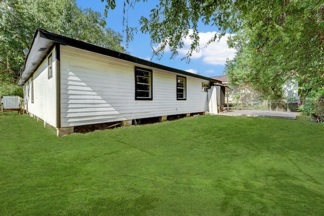 rear view of property with a yard