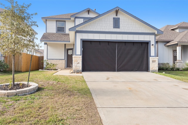 view of front of home with a garage and a front lawn