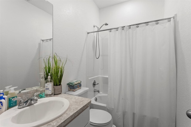 bathroom featuring vanity, toilet, shower / bathtub combination with curtain, and a textured wall