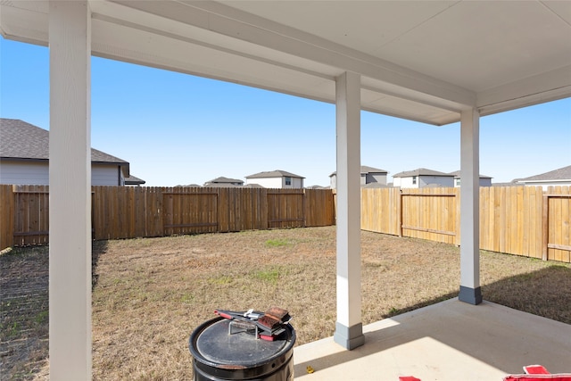 view of yard with a patio area and a fenced backyard