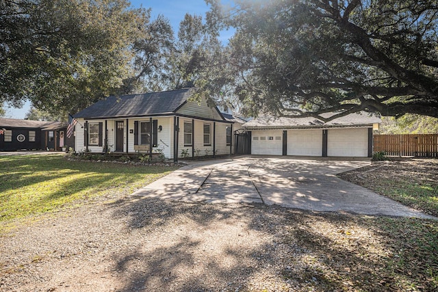 view of front facade with a garage and a front lawn