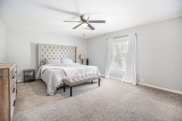 bedroom featuring light carpet and ceiling fan