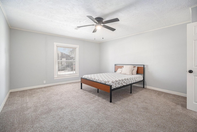 carpeted bedroom with ceiling fan, crown molding, and a textured ceiling