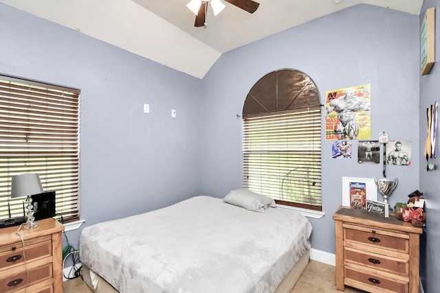 bedroom featuring ceiling fan and lofted ceiling