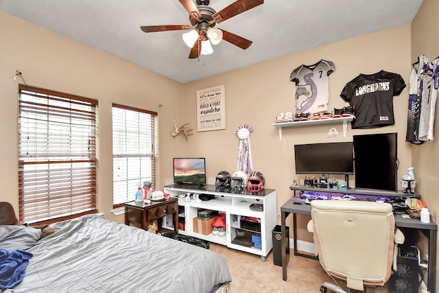 tiled bedroom featuring ceiling fan