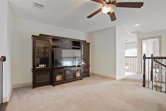 living room with light carpet and ceiling fan