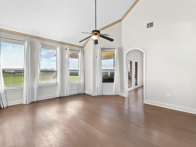 unfurnished living room featuring crown molding, high vaulted ceiling, dark hardwood / wood-style floors, and ceiling fan