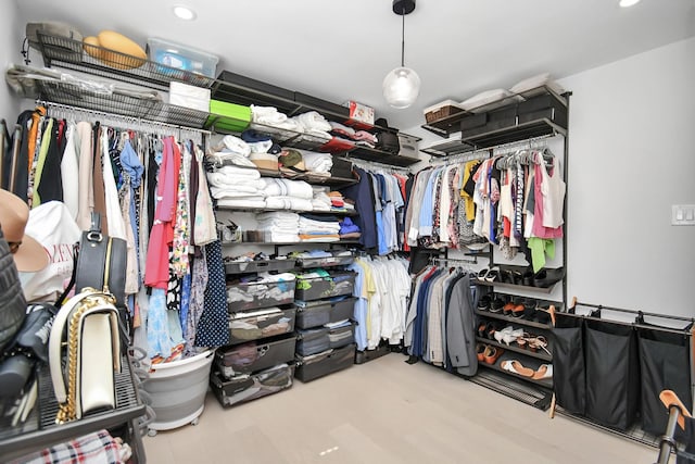 spacious closet featuring light hardwood / wood-style flooring